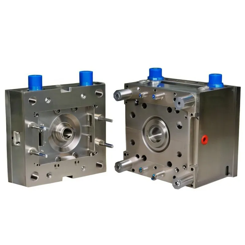Two sections of a plastic injection mold with metal components and blue caps.