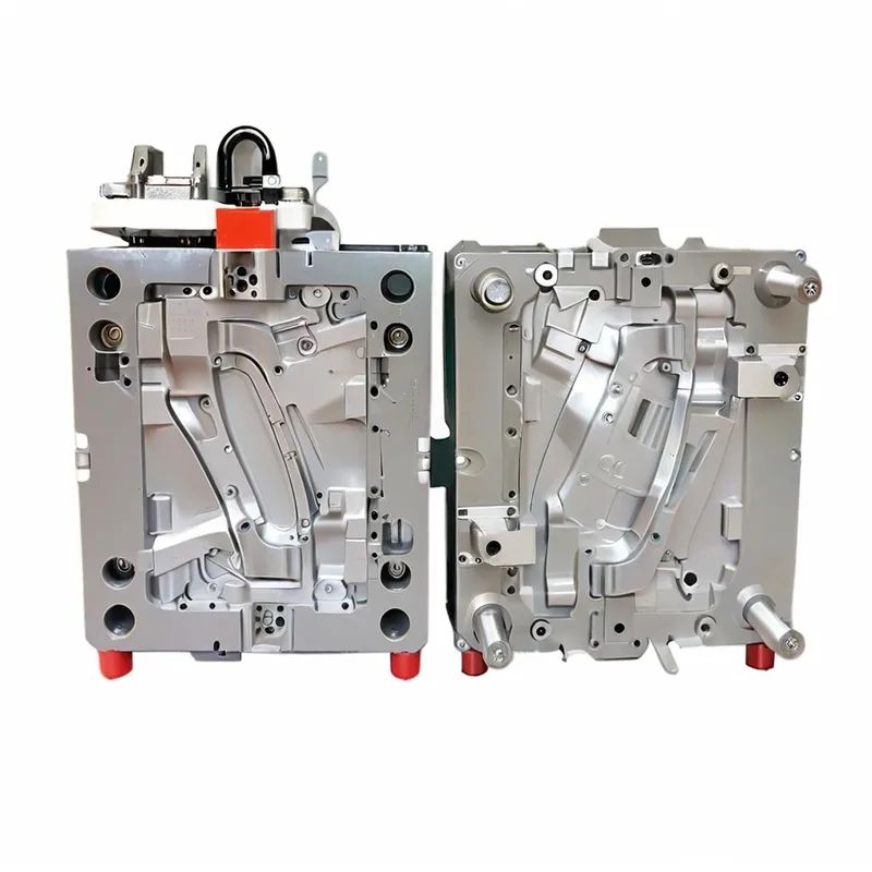 A detailed automotive injection mold with red support pegs.