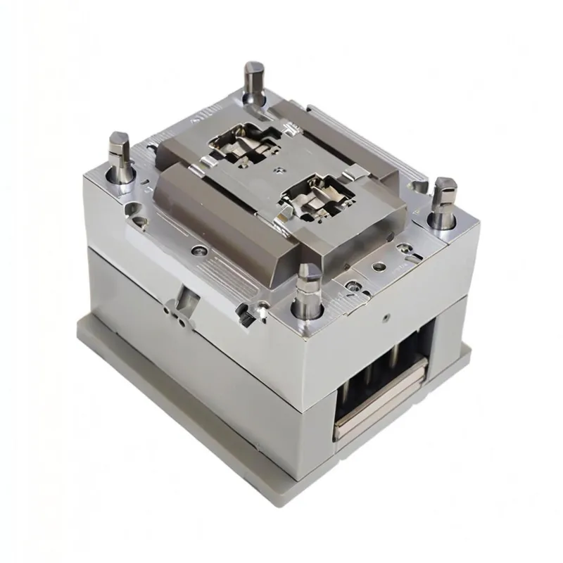 A metal injection mold base with cylindrical components and a rectangular central section.
