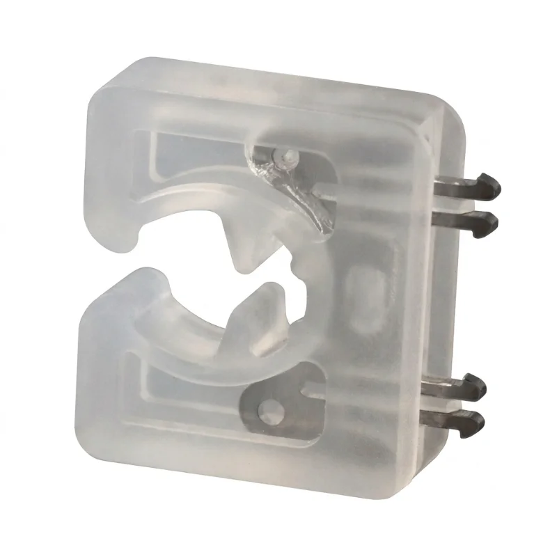 A close-up view of a transparent plastic injection molded part with metal connectors.